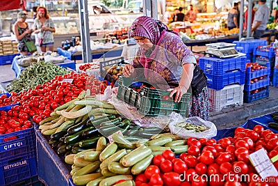 The seller of vegetables in the Turkish market. Kemer, Turkey. Editorial Stock Photo