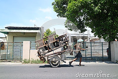 Sellers of traditional wooden chairs around selling their wares. Sidoarjo, Indonesia - November 2020 Editorial Stock Photo