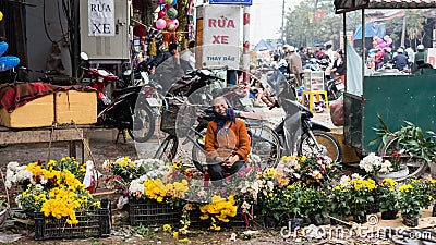 Selling flowers on lunar new year-Tet Holiday Editorial Stock Photo