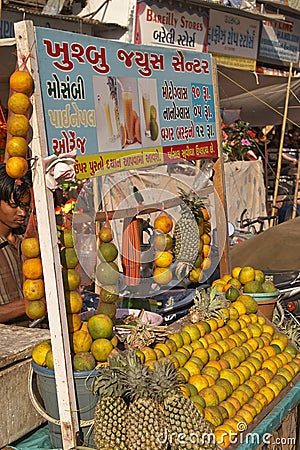 Selling Fruit Juice at a Street Market in India Editorial Stock Photo