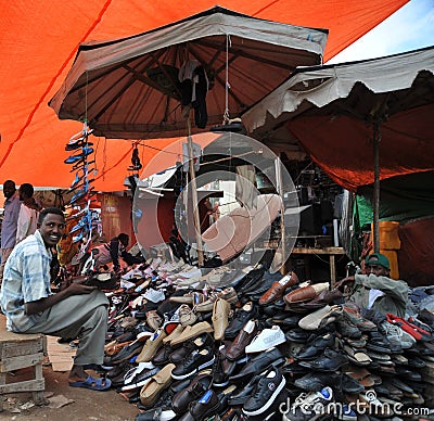 Selling shoes on the street of African city of Hargeysa Editorial Stock Photo
