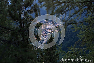 Selva di Val Gardena in the Evening, the lights glowing in this Alpine Town. Wolkenstein in GrÃ¶den is a well known Stock Photo