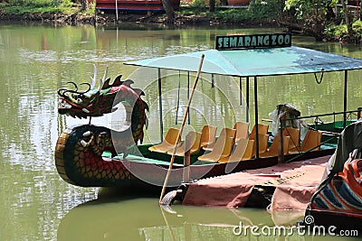 Semarang,December 2022.Dragon boat to go around the lake in the zoo to see pelicans Editorial Stock Photo