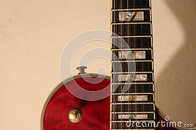 A semi acoustic electric guitar in red color Stock Photo