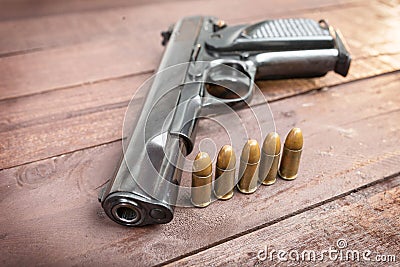 Semi-automatic 9mm gun on wooden background Stock Photo