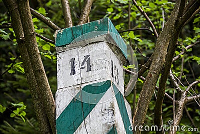 Semi fallen wooden border pillar in national park Skolivski beskidy, Lviv region, Ukraine Stock Photo