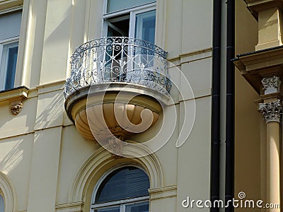 Semi round balcony on old classical european residential building Stock Photo