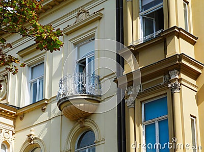 Semi round balcony on old classical european residential building Stock Photo