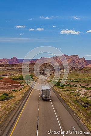 Semi-truck on desert highway in Utah Stock Photo