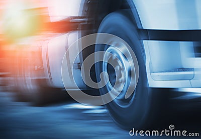 Semi Truck Fast Speed Motion. Spinning Truck Wheels. Trucks Driving on the Road. Diesel Truck. Freight Truck Logistics Transport. Stock Photo