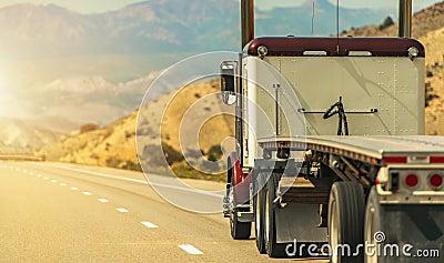 Semi Truck with Flatbed Trailer on a Scenic Utah Road Stock Photo