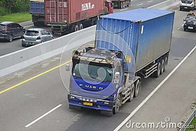 Semi Truck Mitsubishi Fuso The Great with 40ft Container Editorial Stock Photo