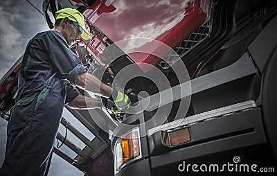 Semi Truck Professional Mechanic Servicing Vehicle Stock Photo