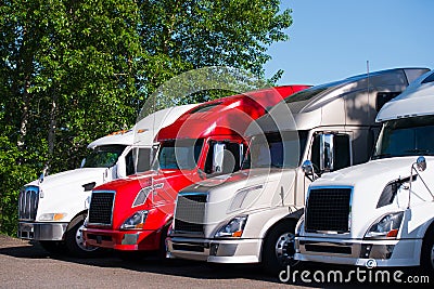 Semi trucks models in row on truck stop parking lot Stock Photo