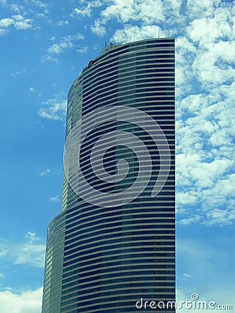 Semicircular blue glass skyscraper Stock Photo