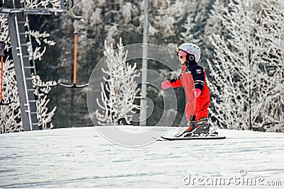 Semmering, Austria. A child is skiing on snow covered slope in austrian Alps. Mountains ski resort Editorial Stock Photo