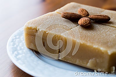 Semolina Halva with Almonds cut in square. Stock Photo
