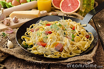Semolina pasta with roasted garlic, sprinkled microherbs Stock Photo