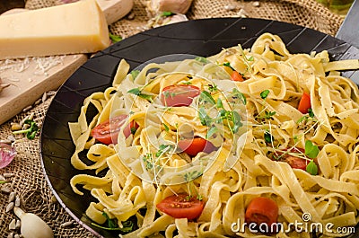 Semolina pasta with roasted garlic, sprinkled microherbs Stock Photo