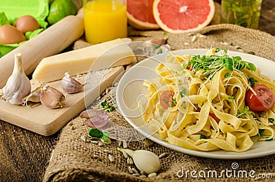 Semolina pasta with roasted garlic, sprinkled microherbs Stock Photo