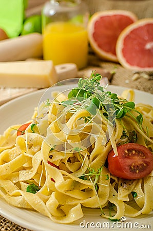 Semolina pasta with roasted garlic, sprinkled microherbs Stock Photo