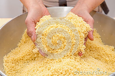 Semolina preparation for couscous Stock Photo