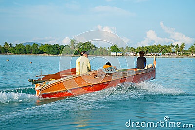 Orange boat speeding across bay Editorial Stock Photo