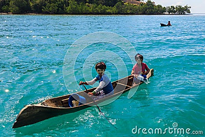 Unidentified local BAJAU LAUT people on wooden boat Editorial Stock Photo