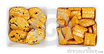 Senbei, Japanese rice crackers, crispy snacks, in white square bowls Stock Photo
