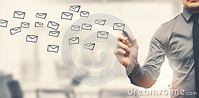 Sending email concept - businessman drawing envelopes in office Stock Photo