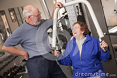 Senior Adult Couple in the Gym Stock Photo