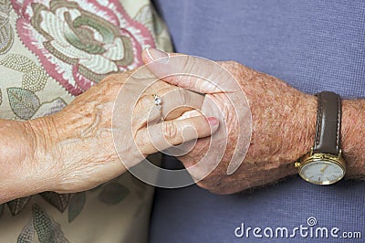 Senior Adult Couple Holding Hands Stock Photo