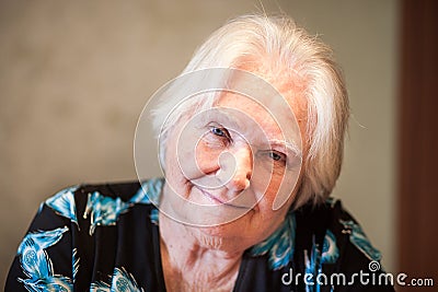 Senior adult woman smile into the camera, old age grandmother Stock Photo