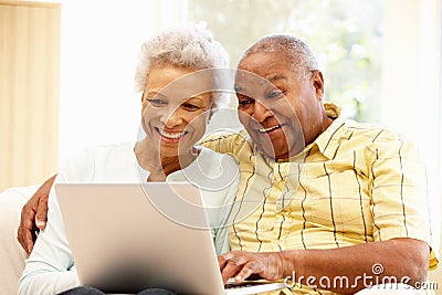 Senior African American couple using laptop Stock Photo