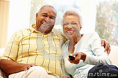 Senior African American couple watching TV Stock Photo