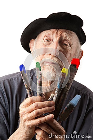 Senior artist with beret and brushes Stock Photo