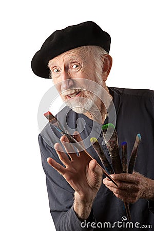 Senior artist with beret and brushes Stock Photo