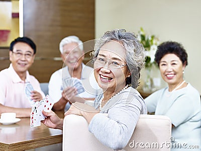 Senior asian woman in card game Stock Photo