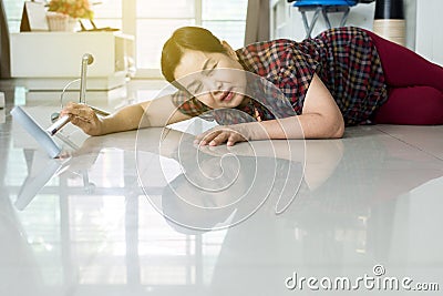 Senior Asian woman suffering with faint lying on floor after falling down stair at home Stock Photo