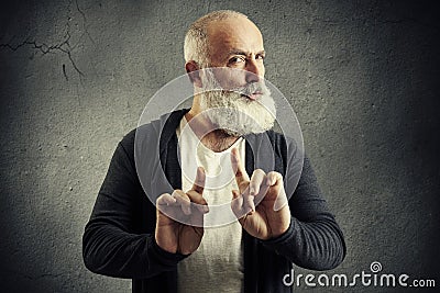 Senior bearded man showing refusal sign Stock Photo