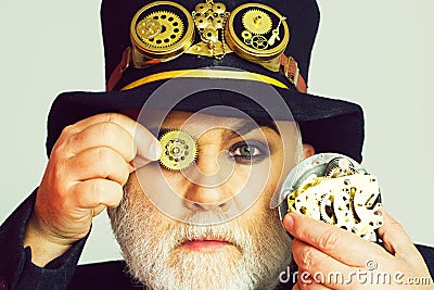 Man keeps cogwheel and gears Stock Photo