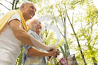 Senior on bicycle trip Stock Photo