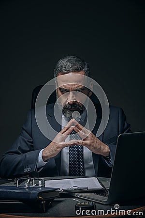 Evil senior business man Stock Photo
