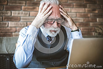 Senior business makes headache. Stock Photo