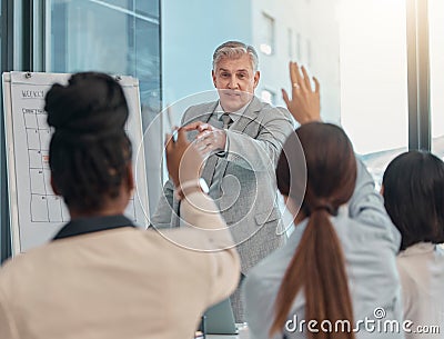 Senior businessman, coaching and presentation with question in team collaboration or engagement at office. Elderly male Stock Photo