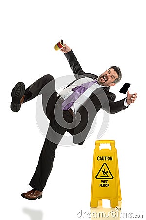 Senior Businessman Falling on Wet Floor Stock Photo