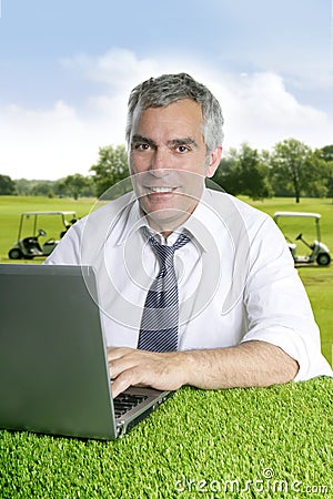 Senior businessman golf course computer Stock Photo