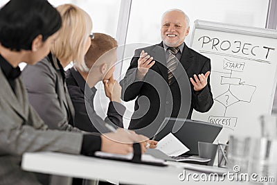 Senior businessman presenting on meeting Stock Photo