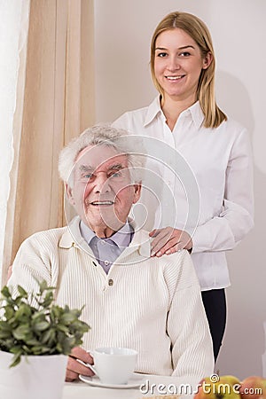 Senior care assistant and retiree Stock Photo