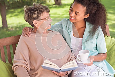 Senior and carer being friends Stock Photo